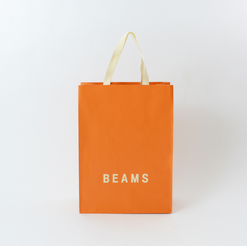 オレンジのブランドカラーがまぶしい紙袋 | オリジナルパッケージの ...
